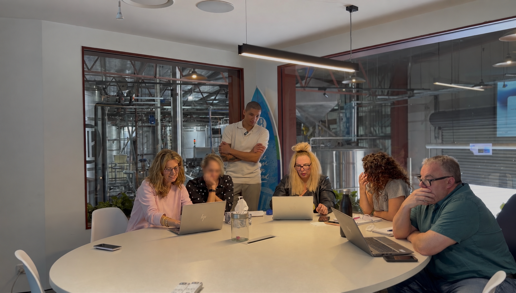 Working together around the table during an AI session