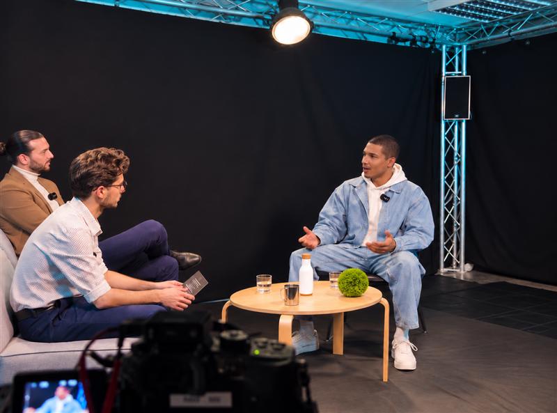 Alex Lepinay in conversation during a studio interview