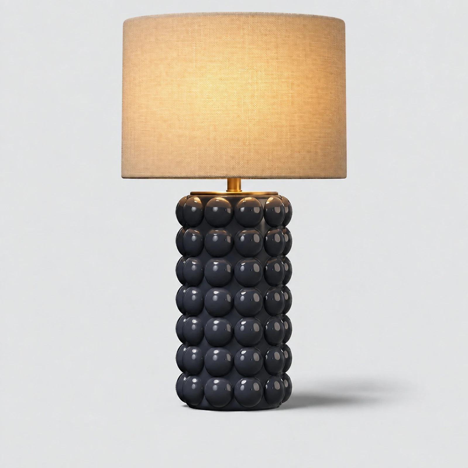 Prepared Neovaa product image of a blue Condotti table lamp with its shade lit.
